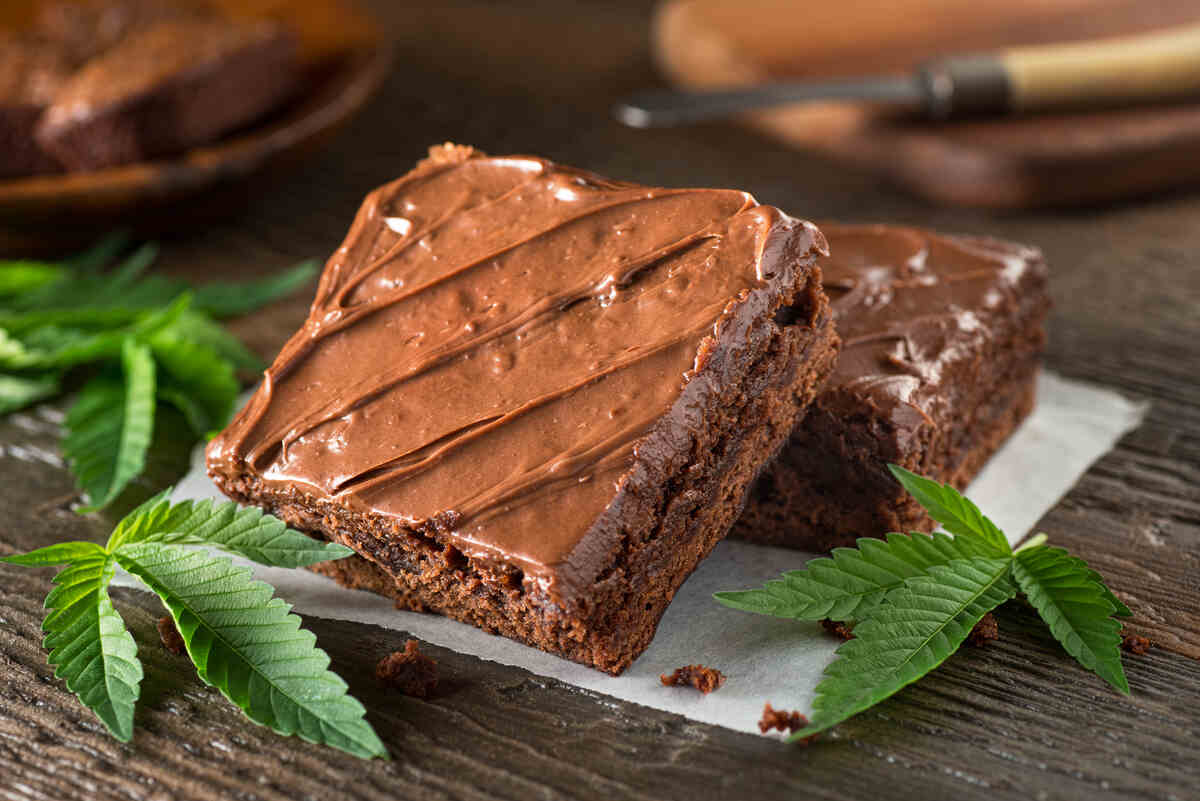 Home made Cannabis brownies with cannabis leaf.