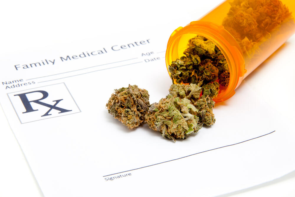 Medical cannabis form with cannabis on top of it