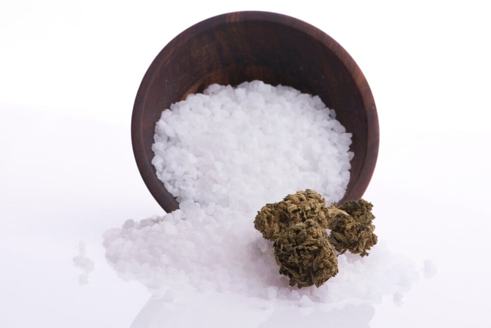 cannabis bud sitting on top of epsom salt