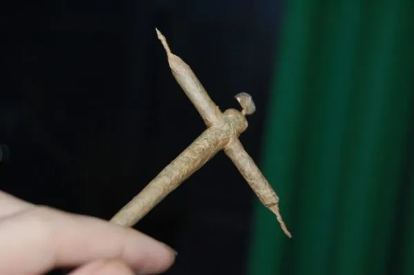 hand holding a cross joint