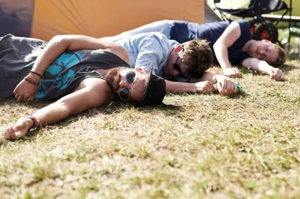 three men laying on the floor because of a weed hangover