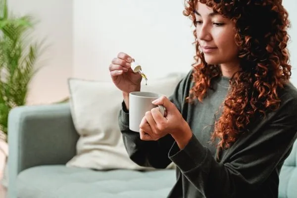 woman-taking-CBD-drops