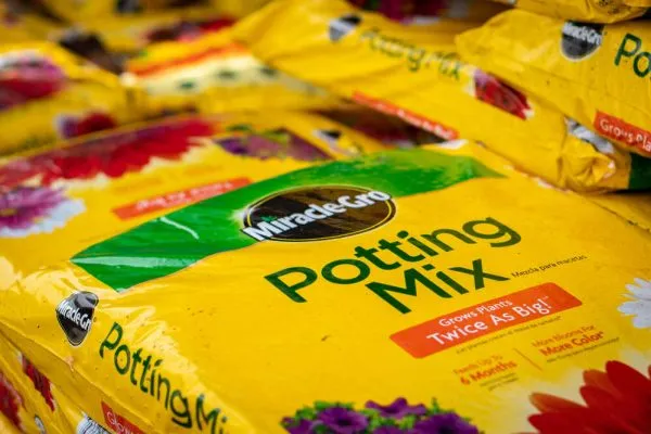 a stack of miracle gro soil